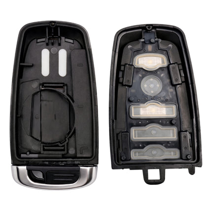 Disassembled car key casing with internal front, back panel, battery compartment and key blade