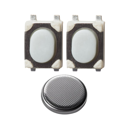 Two micro switches front view, and a round battery, arranged on a white background.