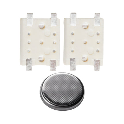 Two micro switches back view, and a round battery, arranged on a white background.