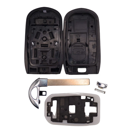 Disassembled car key casing with front cover, back panel and battery compartment